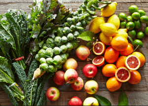a group of fruits and vegetables on a wood surface Healthy Weight Loss Diets Richmond upon Thames
