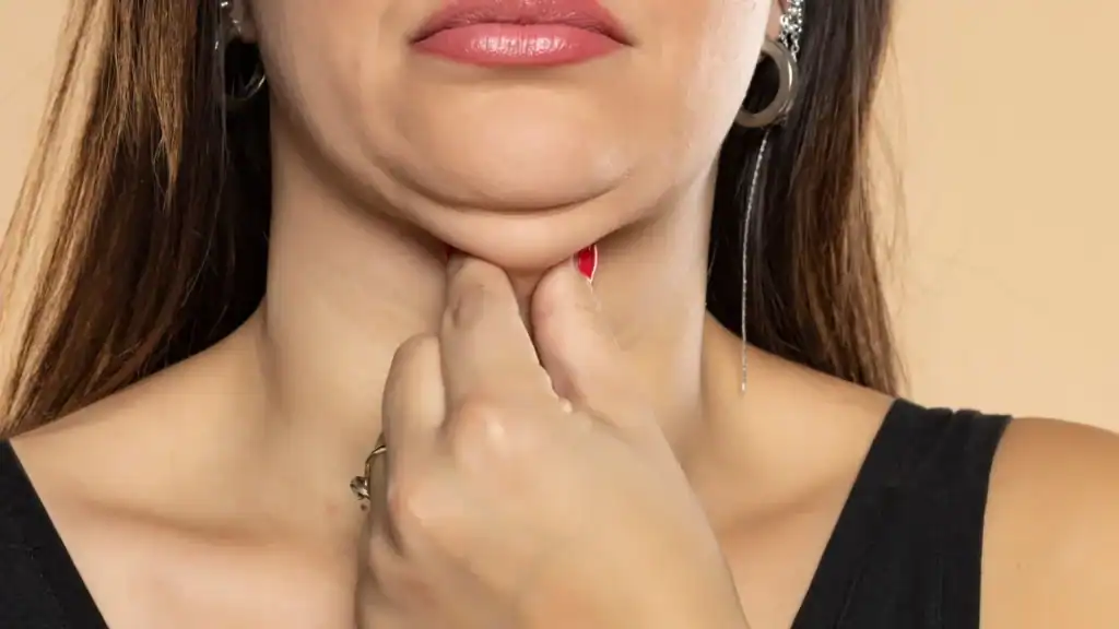 An image of a woman with double chin, sad, worried : Non Surgical Double Chin Removal Treatment in Richmond upon Thames, UK